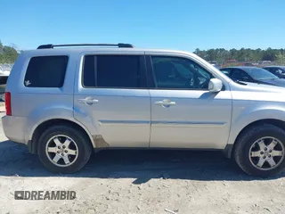2011 Honda Pilot Touring with VIN 5FNYF4H91BB086712, listed as a IAAI auction lot 41809369 with 260,718 mi miles. Bid and sale history available at carsss.com. Image 13.