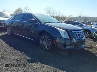 2013 Cadillac XTS Luxury with VIN 2G61R5S37D9102425, listed as a IAAI auction lot 42059995 with 174,901 mi miles. Bid and sale history available at carsss.com. Image 1.