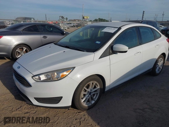 2018 Ford Focus SE z VIN 1FADP3F23JL328462, wystawiony jako IAAI lot #42068209 z przebiegiem 63 194 mil mil oraz . Historia ofert i sprzedaży dostępna na DreamBid. Obrazek 2.
