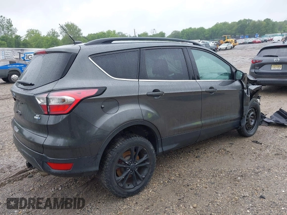 2017 Ford Escape SE z VIN 1FMCU9G95HUC83618, wystawiony jako IAAI lot #42324672 z przebiegiem 132 910 mil mil oraz . Historia ofert i sprzedaży dostępna na DreamBid. Obrazek 4.