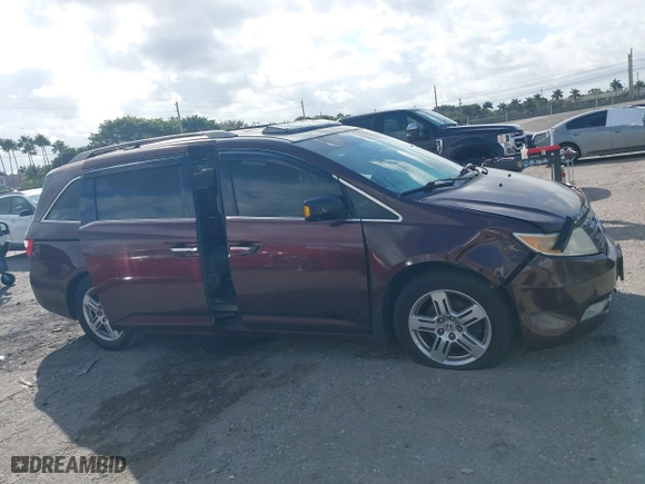 2011 Honda Odyssey Touring with VIN 5FNRL5H97BB008759, listed as a IAAI auction lot 41567010 with 215,709 mi miles. Bid and sale history available at carsss.com. Image 13.