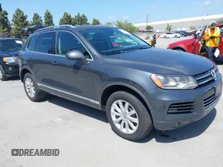 2012 Volkswagen Touareg Sport with VIN WVGFK9BP8CD003725, listed as a IAAI auction lot 42064453 with 145,695 mi miles and . Bid and sale history available at DreamBid. Image 1.