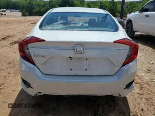 2020 Honda Civic LX z VIN 2HGFC2F64LH592299, wystawiony jako Copart lot #57040525 z przebiegiem 154 093 mil mil oraz Szkoda całkowita • Salvage title. Historia ofert i sprzedaży dostępna na DreamBid. Obrazek 6.