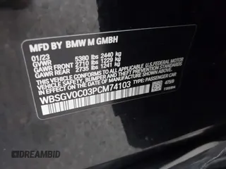 2023 BMW M8 Competition with VIN WBSGV0C03PCM74103, listed as a IAAI auction lot 40976144 with 21,035 mi miles. Bid and sale history available at carsss.com. Image 9.