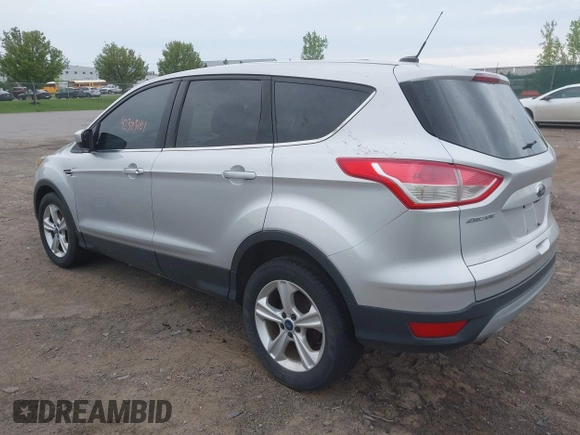 2014 Ford Escape SE z VIN 1FMCU9GX9EUC35713, wystawiony jako IAAI lot #42323161 z przebiegiem 169 393 mil mil oraz . Historia ofert i sprzedaży dostępna na DreamBid. Obrazek 3.