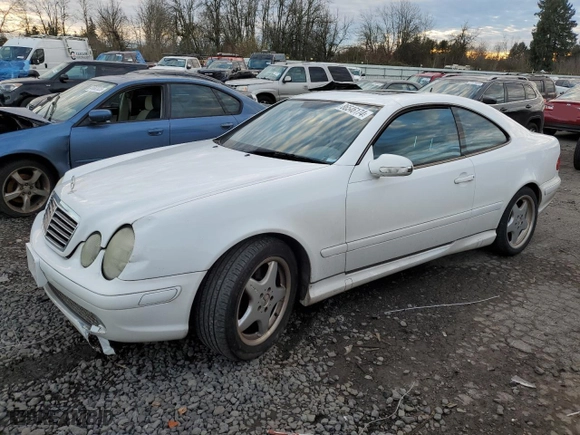 2001 Mercedes-Benz CLK-Class with VIN WDBLJ70G91F185789, listed as a Copart auction lot 86546174 with 140,958 mi miles and Salvage Title. Bid and sale history available at carsss.com. Image 1.