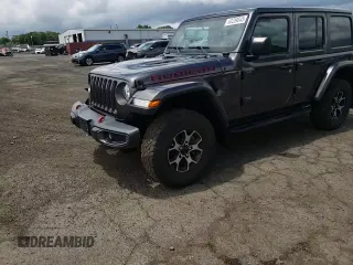 2018 Jeep Wrangler Unlimited Rubicon with VIN 1C4HJXFG1JW261472, listed as a Copart auction lot 63259345 with 60,457 mi miles and Salvage title. Bid and sale history available at DreamBid. Image 13.