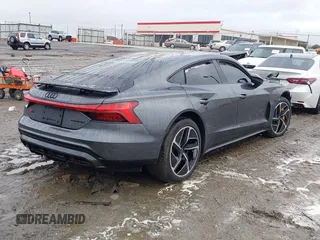 2023 Audi RS e-tron GT z VIN WAUBHBFWXP7903392, wystawiony jako IAAI lot #41020487 z przebiegiem 9046 mil mil oraz . Historia ofert i sprzedaży dostępna na DreamBid. Obrazek 4.