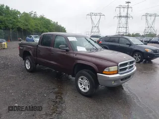 2004 Dodge Dakota SLT z VIN 1D7HG48N04S718220, wystawiony jako IAAI lot #42258803 z przebiegiem 250 757 mil mil oraz . Historia ofert i sprzedaży dostępna na DreamBid. Obrazek 1.