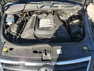 2004 Volkswagen Touareg z VIN WVGEM77L64D051760, wystawiony jako Copart lot #87044304 z przebiegiem Nie podano mil oraz Szkoda całkowita • Salvage title. Historia ofert i sprzedaży dostępna na DreamBid. Obrazek 13.