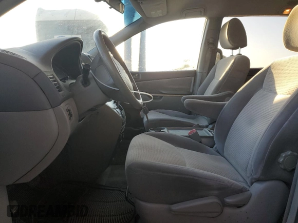 2010 Toyota Sienna CE with VIN 5TDKK4CC6AS329753, listed as a Copart auction lot 54374515 with 144,654 mi miles and Salvage Title. Bid and sale history available at DreamBid. Image 7.