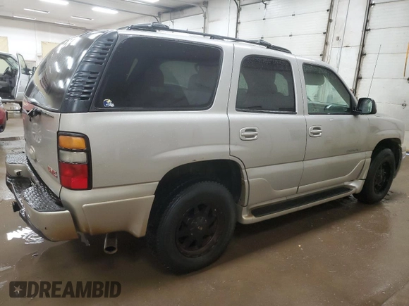2005 GMC Yukon Denali z VIN 1GKEK63U45J222600, wystawiony jako Copart lot #51329775 z przebiegiem 287 293 mil mil oraz Czysty tytuł • Clean title. Historia ofert i sprzedaży dostępna na DreamBid. Obrazek 3.