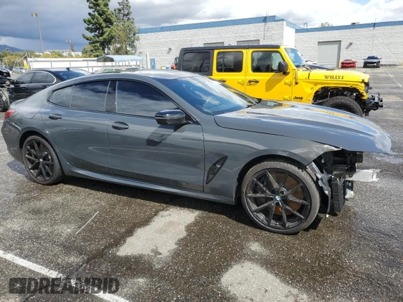 2025 BMW 8 Series M850i with VIN WBAGV8C07SCT18237, listed as a Copart auction lot 49277375 with 750 mi miles and Salvage title. Bid and sale history available at DreamBid. Image 4.