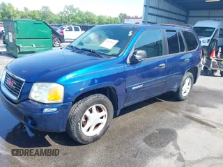 2004 GMC Envoy SLE with VIN 1GKDT13S242391968, listed as a IAAI auction lot 42079420 with 234,611 mi miles. Bid and sale history available at carsss.com. Image 2.