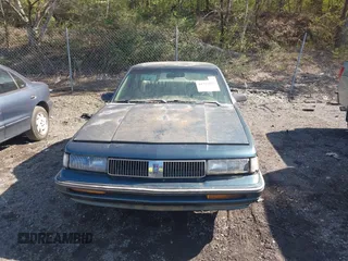 1993 Oldsmobile Cutlass Ciera S with VIN 1G3AG55N5P6317040, listed as a IAAI auction lot 41777055 with 208,984 mi miles and . Bid and sale history available at DreamBid. Image 12.