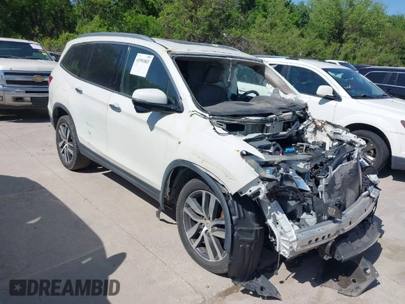 2016 Honda Pilot Touring with VIN 5FNYF6H97GB088824, listed as a IAAI auction lot 41991803 with 84,761 mi miles. Bid and sale history available at carsss.com. Image 1.