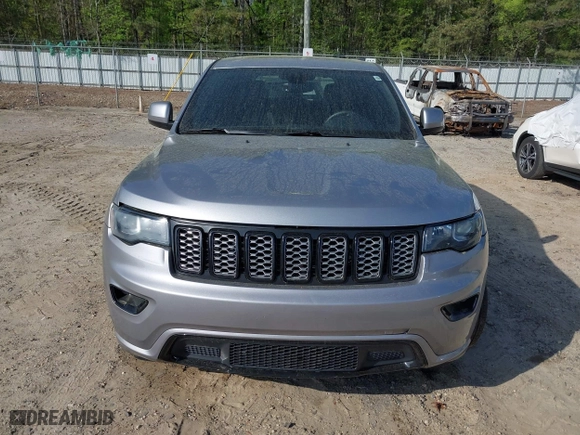 2018 Jeep Grand Cherokee Laredo E with VIN 1C4RJFAG0JC284927, listed as a IAAI auction lot 41964013 with 130,145 mi miles. Bid and sale history available at carsss.com. Image 12.