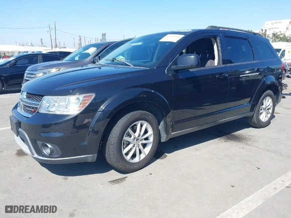 2013 Dodge Journey SXT with VIN 3C4PDCBG8DT636995, listed as a IAAI auction lot 42012559 with 105,120 mi miles. Bid and sale history available at carsss.com. Image 2.
