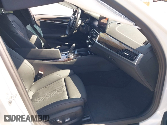 2023 BMW 5 Series 530e with VIN WBA13AG09PCM41820, listed as a IAAI auction lot 42409541 with 17,715 mi miles and . Bid and sale history available at DreamBid. Image 5.