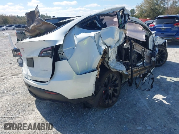 2023 Tesla Model Y Long Range with VIN 7SAYGAEE1PF665934, listed as a IAAI auction lot 41780949 with 21,949 mi miles and . Bid and sale history available at DreamBid. Image 4.