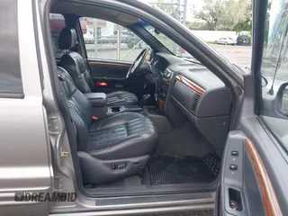 1999 Jeep Grand Cherokee Limited z VIN 1J4GW68N3XC597468, wystawiony jako IAAI lot #42353732 z przebiegiem 201 388 mil mil oraz . Historia ofert i sprzedaży dostępna na DreamBid. Obrazek 5.