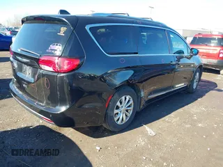 2018 Chrysler Pacifica Touring L with VIN 2C4RC1BGXJR157184, listed as a IAAI auction lot 41803388 with 102,095 mi miles and . Bid and sale history available at DreamBid. Image 4.