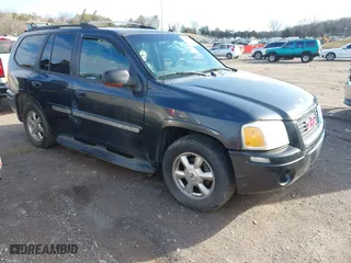 2004 GMC Envoy SLE with VIN 1GKDT13S242130520, listed as a IAAI auction lot 41503717 with 167,426 mi miles. Bid and sale history available at carsss.com. Image 1.