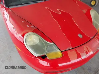 1999 Porsche Boxster z VIN WP0CA2985XU621543, wystawiony jako IAAI lot #42210875 z przebiegiem 93 609 mil mil oraz . Historia ofert i sprzedaży dostępna na DreamBid. Obrazek 6.