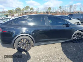 2023 Tesla Model X with VIN 7SAXCAE59PF377408, listed as a IAAI auction lot 41176738 with 32,496 mi miles and . Bid and sale history available at DreamBid. Image 13.