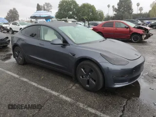 2023 Tesla Model 3 with VIN 5YJ3E1EA5PF640805, listed as a Copart auction lot 48389265 with 28,193 mi miles and Salvage title. Bid and sale history available at DreamBid. Image 4.