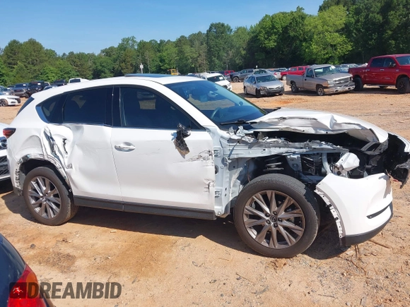 2021 Mazda CX-5 Grand Touring with VIN JM3KFBDM3M0493752, listed as a IAAI auction lot 42456854 with 35,122 mi miles and . Bid and sale history available at DreamBid. Image 13.