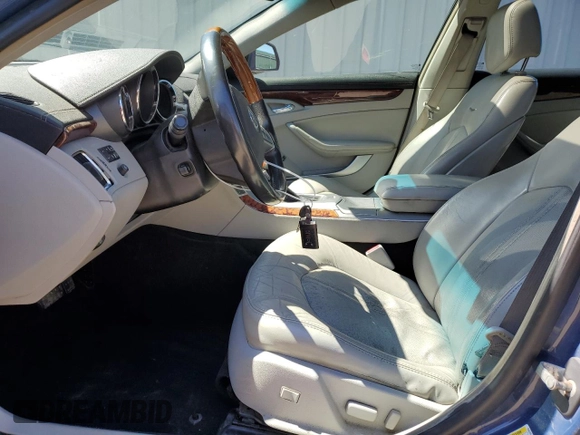 2009 Cadillac CTS AWD with VIN 1G6DH577390123365, listed as a Copart auction lot 54815885 with 141,026 mi miles and Salvage Title. Bid and sale history available at DreamBid. Image 7.