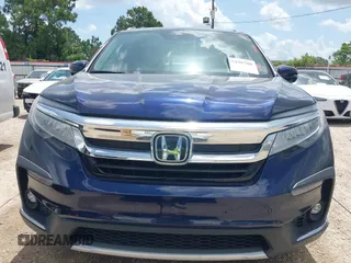 2022 Honda Pilot Touring 7-Passenger with VIN 5FNYF5H61NB019768, listed as a IAAI auction lot 42438780 with Not provided miles and . Bid and sale history available at DreamBid. Image 13.
