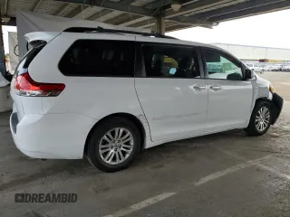 2012 Toyota Sienna XLE AAS with VIN 5TDYK3DC7CS275496, listed as a Copart auction lot 62612815 with 130,027 mi miles and Salvage title. Bid and sale history available at DreamBid. Image 3.