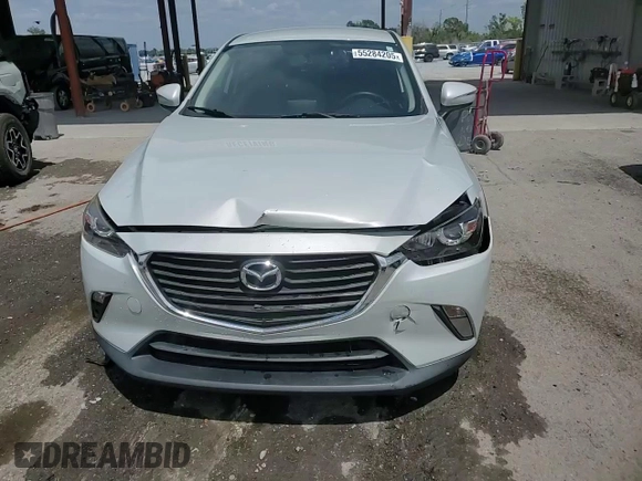 2017 Mazda CX-3 Touring z VIN JM1DKDC78H0150588, wystawiony jako Copart lot #55284205 z przebiegiem 78 923 mil mil oraz Szkoda całkowita • Salvage title. Historia ofert i sprzedaży dostępna na DreamBid. Obrazek 14.
