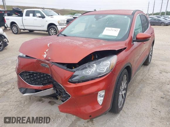 2020 Ford Escape Titanium Hybrid with VIN 1FMCU0DZ1LUB13684, listed as a IAAI auction lot 41629782 with 31,669 mi miles and . Bid and sale history available at DreamBid. Image 2.