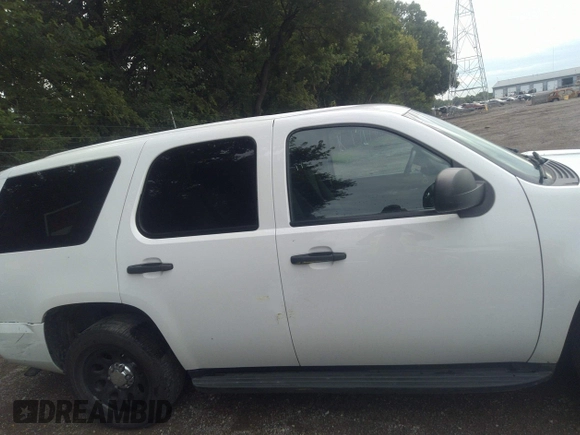 2013 Chevrolet Tahoe Commercial with VIN 1GNLC2E05DR351035, listed as a IAAI auction lot 42641974 with 265,608 mi miles and . Bid and sale history available at DreamBid. Image 13.