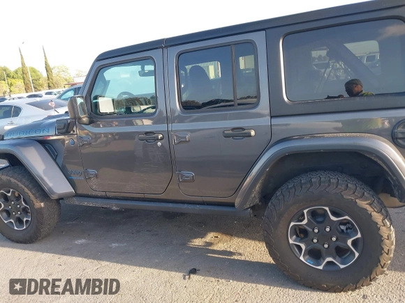 2023 Jeep Wrangler Rubicon with VIN 1C4JJXR67PW662277, listed as a IAAI auction lot 41950065 with 35,714 mi miles and . Bid and sale history available at DreamBid. Image 14.