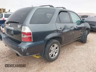 2006 Acura MDX Touring w/Navi with VIN 2HNYD18876H523408, listed as a IAAI auction lot 41756670 with 219,796 mi miles. Bid and sale history available at carsss.com. Image 4.