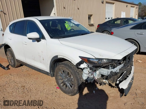 2019 Mazda CX-5 Sport with VIN JM3KFBBM0K0574255, listed as a IAAI auction lot 41661924 with 93,851 mi miles and . Bid and sale history available at DreamBid. Image 1.