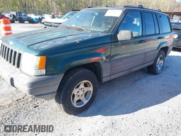 1996 Jeep Grand Cherokee with VIN 1J4EZ58Y7TC128428, listed as a IAAI auction lot 42050443 with 241,591 mi miles and . Bid and sale history available at DreamBid. Image 2.