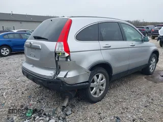 2009 Honda CR-V EX-L with VIN JHLRE487X9C021566, listed as a IAAI auction lot 42008321 with 128,647 mi miles and . Bid and sale history available at carsss.com. Image 4.