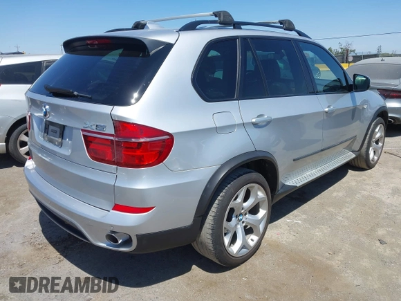 2012 BMW X5 35d with VIN 5UXZW0C58CL671141, listed as a IAAI auction lot 42644381 with 127,464 mi miles and . Bid and sale history available at DreamBid. Image 4.