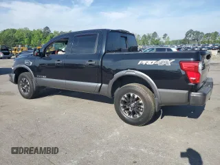2017 Nissan Titan Platinum Reserve with VIN 1N6AA1E53HN569660, listed as a Copart auction lot 54409625 with 98,858 mi miles and Salvage title. Bid and sale history available at DreamBid. Image 2.