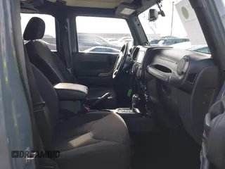 2014 Jeep Wrangler Unlimited Sport with VIN 1C4BJWDG9EL309763, listed as a IAAI auction lot 41378132 with 117,029 mi miles. Bid and sale history available at carsss.com. Image 5.