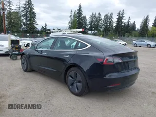 2019 Tesla Model 3 Mid Range with VIN 5YJ3E1EA6KF415656, listed as a IAAI auction lot 42140763 with 71,408 mi miles and . Bid and sale history available at carsss.com. Image 3.