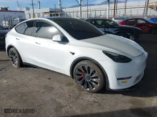 2021 Tesla Model Y Performance with VIN 5YJYGDEF5MF277804, listed as a IAAI auction lot 41421518 with 154,033 mi miles. Bid and sale history available at carsss.com. Image 1.