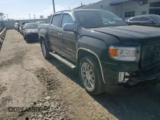 2021 GMC Canyon 4WD Denali with VIN 1GTG6EEN4M1221938, listed as a Copart auction lot 48760965 with 63,231 mi miles and Salvage Title. Bid and sale history available at carsss.com. Image 11.