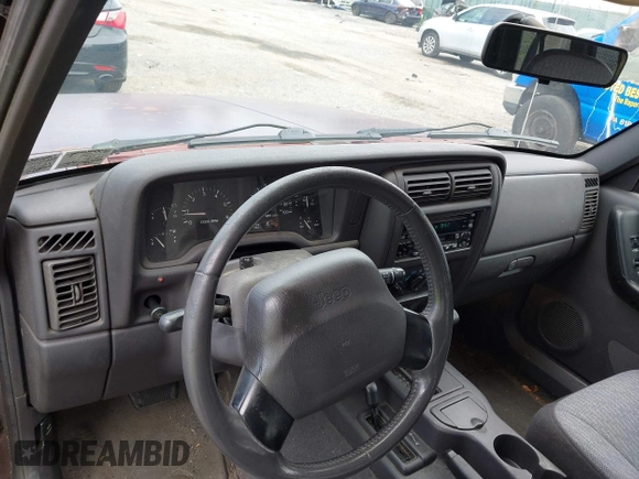 2000 Jeep Cherokee with VIN 1J4FF48SXYL148361, listed as a IAAI auction lot 42786017 with 159,908 mi miles and . Bid and sale history available at DreamBid. Image 14.