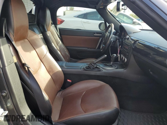 2015 Mazda MX-5 Miata Grand Touring z VIN JM1NC2PF3F0239991, wystawiony jako Copart lot #46989165 z przebiegiem 139 801 mil mil oraz Szkoda całkowita • Salvage title. Historia ofert i sprzedaży dostępna na DreamBid. Obrazek 10.